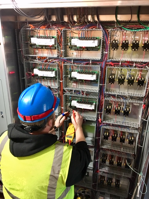 Employee working on control system preventative maintenance