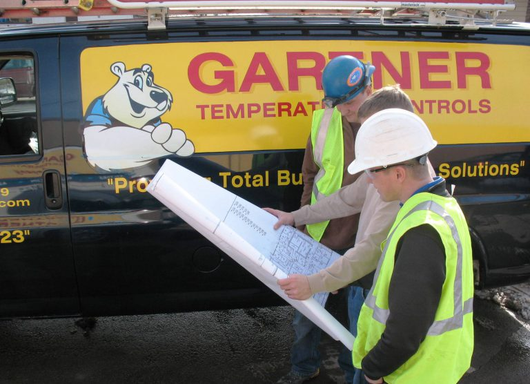 Gartner temperature control team looking at map